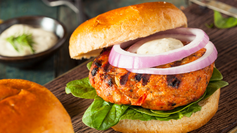 Salmon burger on table