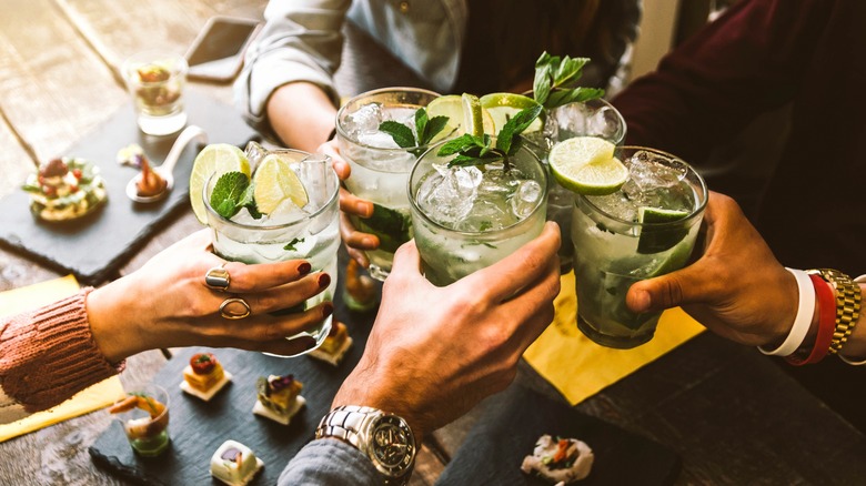 People toasting cocktails