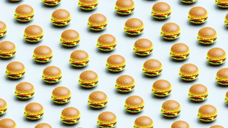 a series of repeating animations of a cheeseburger against a gray background.