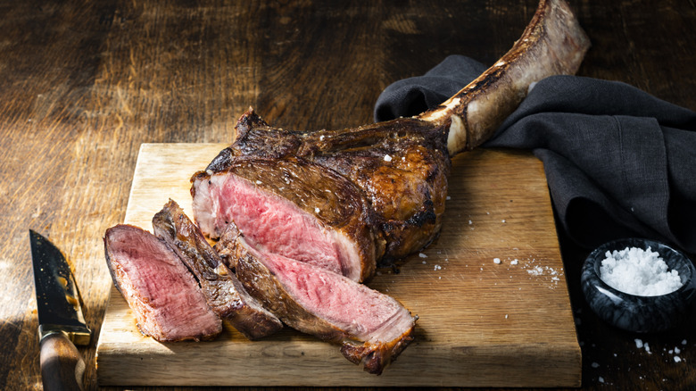 Tomahawk steak on wood board