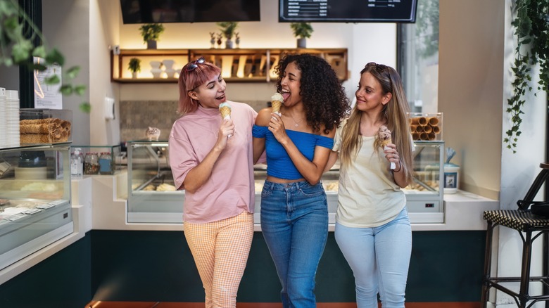 Women getting ice cream cones at an ice cream shop