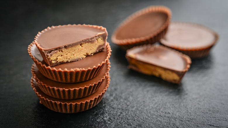 Stack of peanut butter cups on black surface