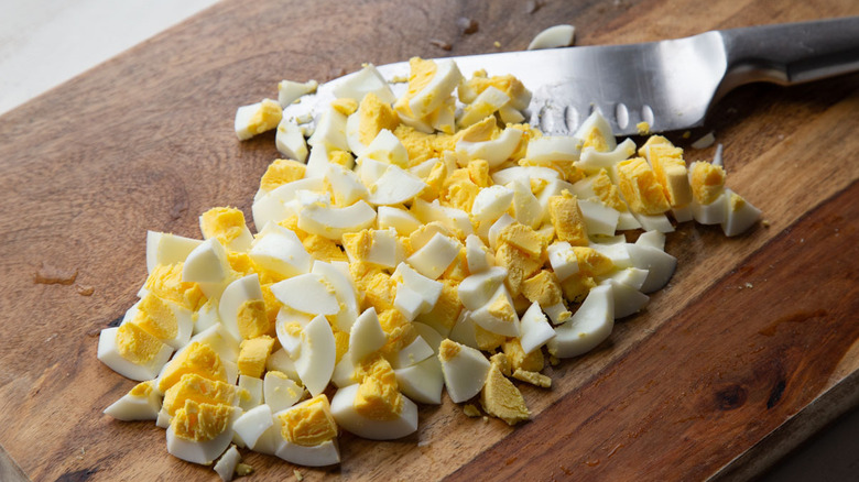 chopped boiled eggs on a piece of wood